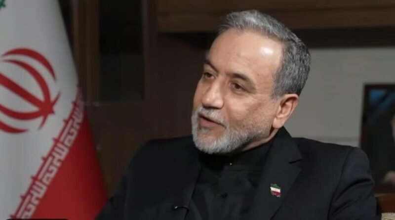 Man speaking with Iranian flag behind